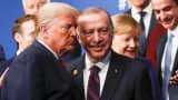 President Donald Trump and Turkey's President Recep Tayyip Erdogan leave the stage after family photo during the annual NATO heads of government summit at the Grove Hotel in Watford, Britain on December 4, 2019.